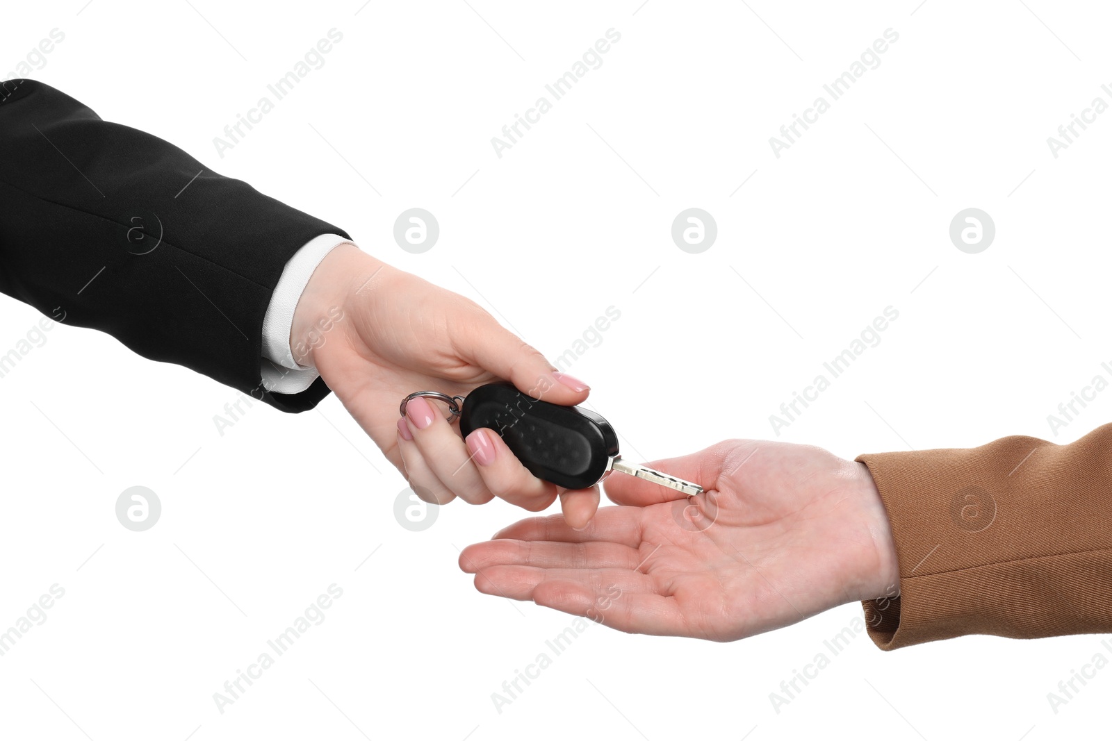 Photo of Dealer giving car key to customer on white background, closeup. Buying auto