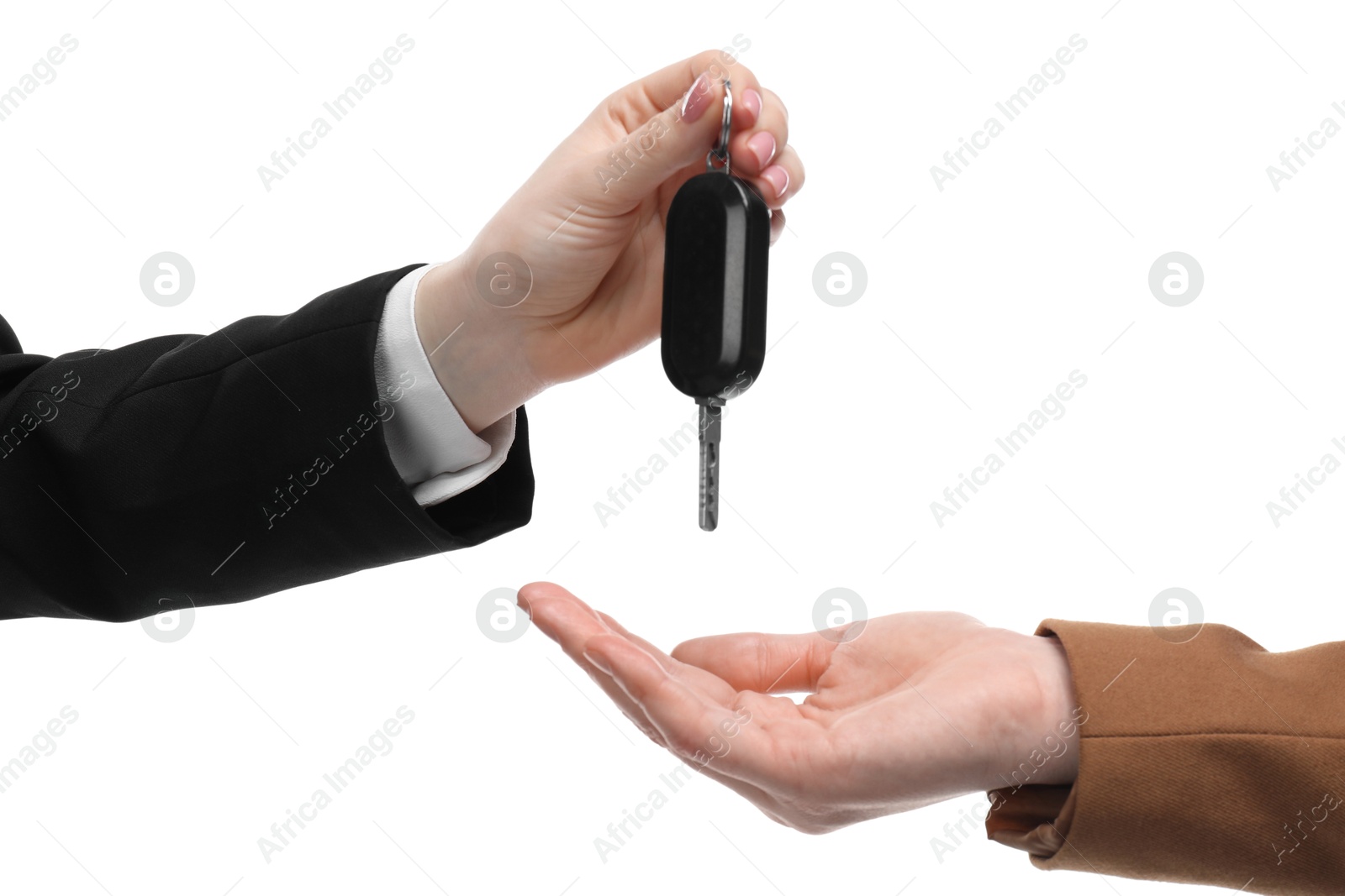 Photo of Dealer giving car key to customer on white background, closeup. Buying auto