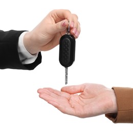 Photo of Dealer giving car key to customer on white background, closeup. Buying auto