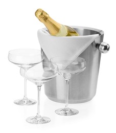 Photo of Bottle of champagne in ice bucket and empty glasses isolated on white