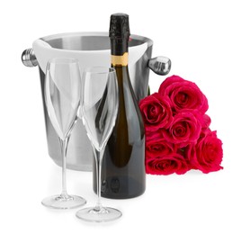 Photo of Bottle of champagne, empty glasses, beautiful roses and ice bucket isolated on white