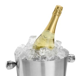 Photo of Bottle of champagne in ice bucket isolated on white