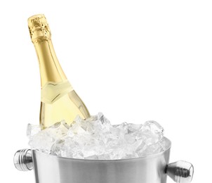 Photo of Bottle of champagne in ice bucket isolated on white