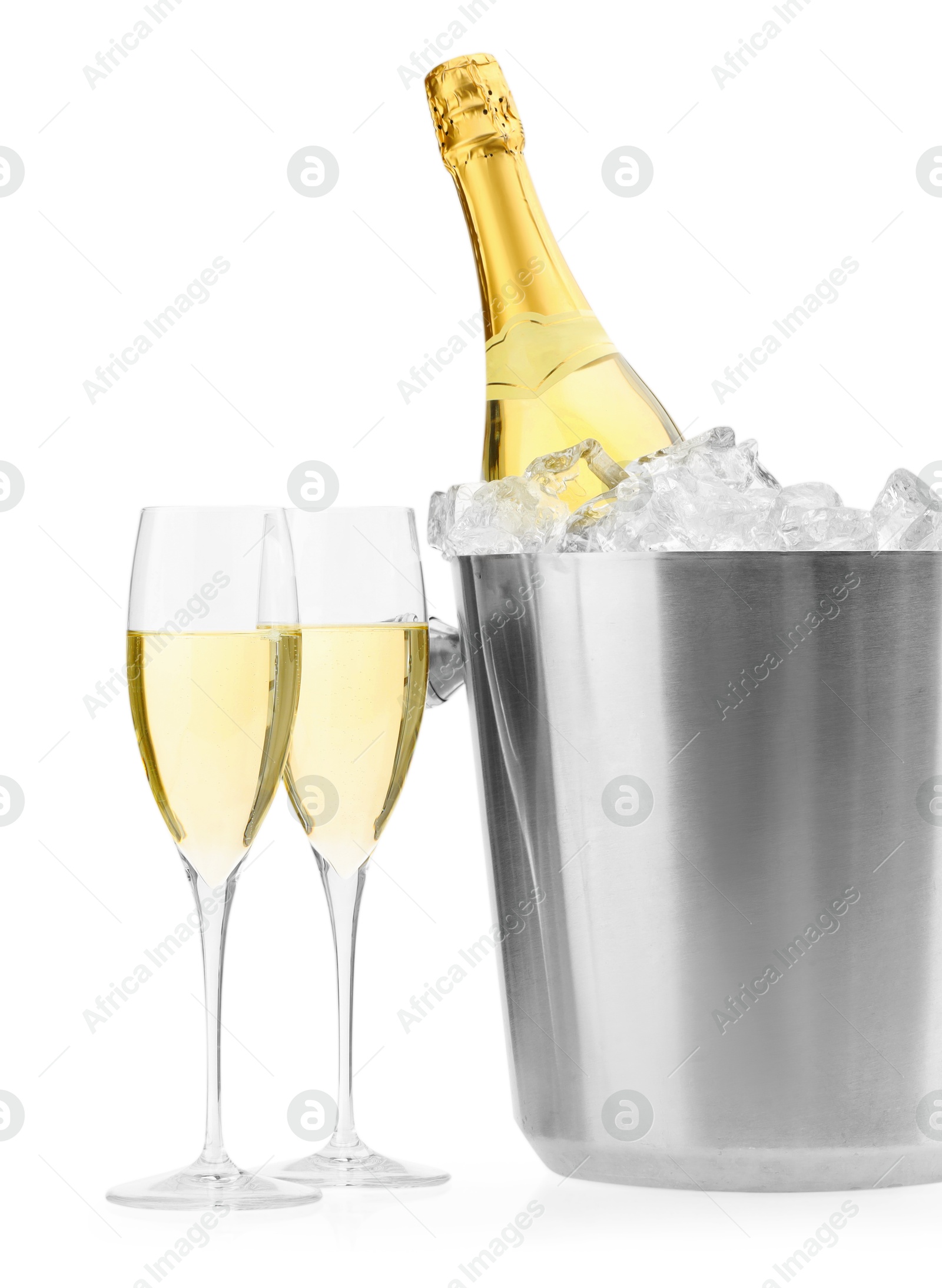 Photo of Champagne in glasses and ice bucket with bottle isolated on white