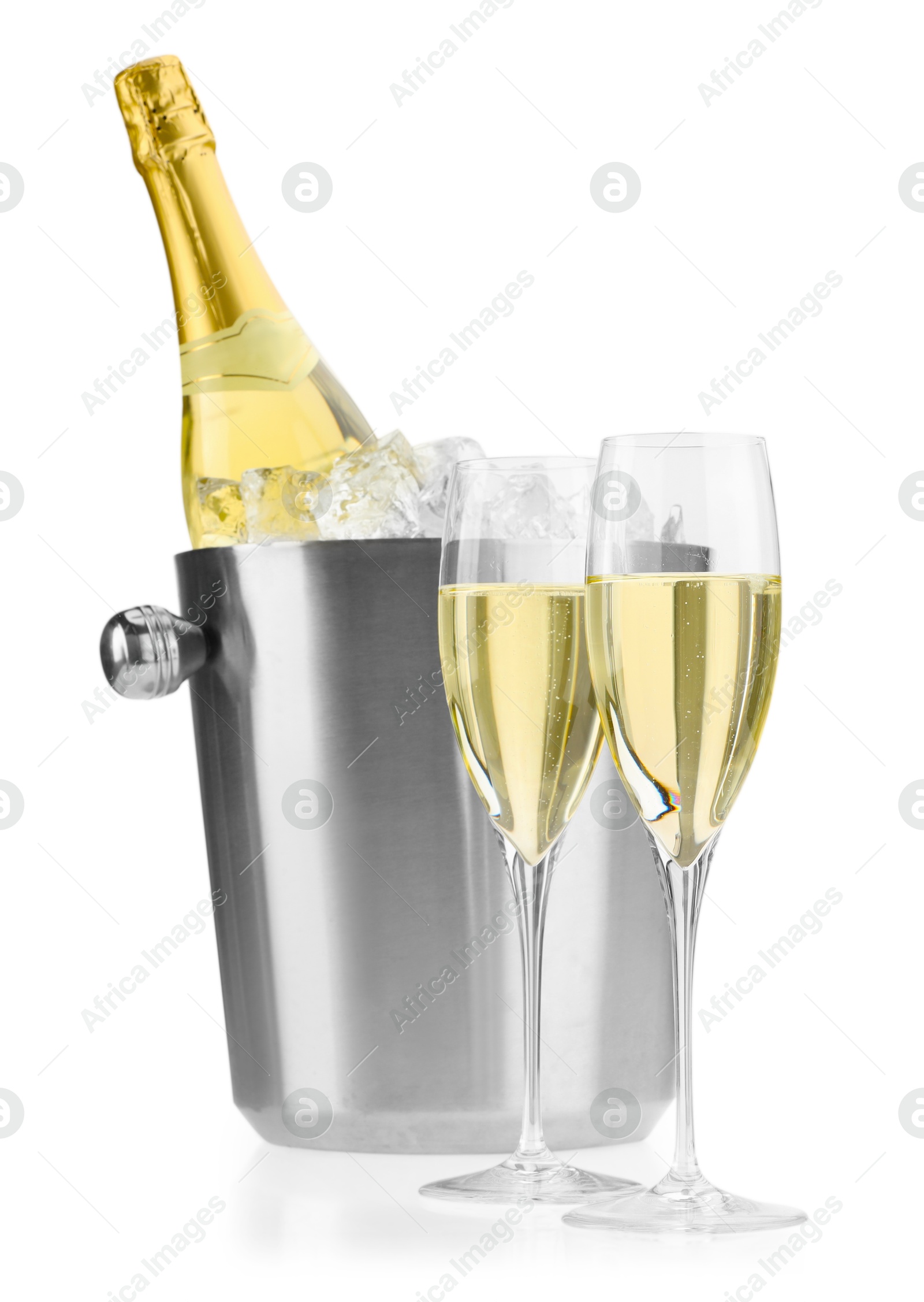 Photo of Champagne in glasses and ice bucket with bottle isolated on white