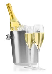 Photo of Champagne in glasses and ice bucket with bottle isolated on white