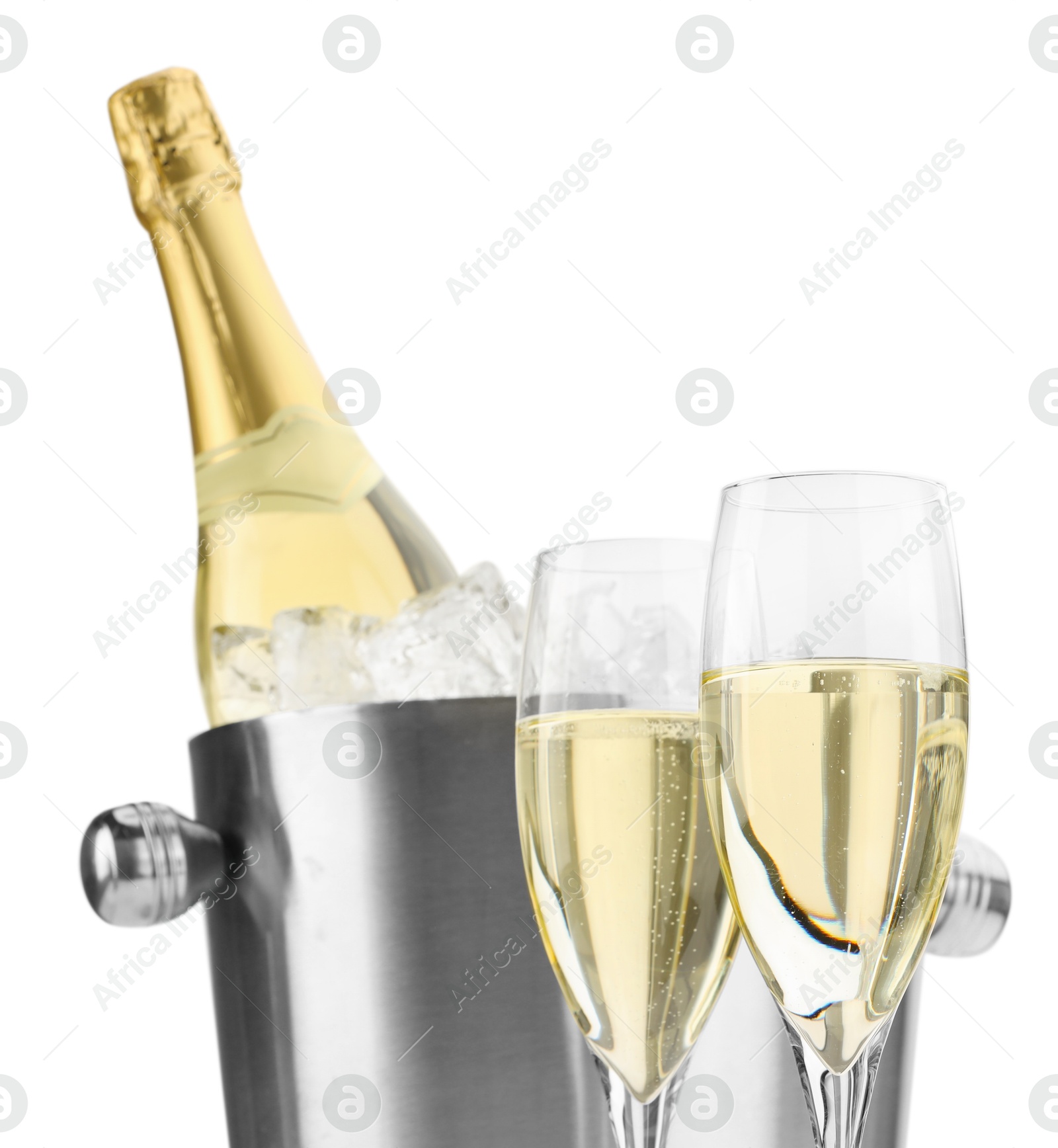 Photo of Champagne in glasses and ice bucket with bottle isolated on white