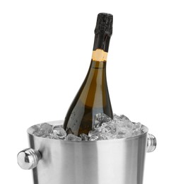 Photo of Bottle of champagne in ice bucket isolated on white