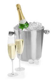 Photo of Champagne in glasses and ice bucket with bottle isolated on white