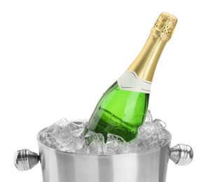 Photo of Bottle of champagne in ice bucket isolated on white