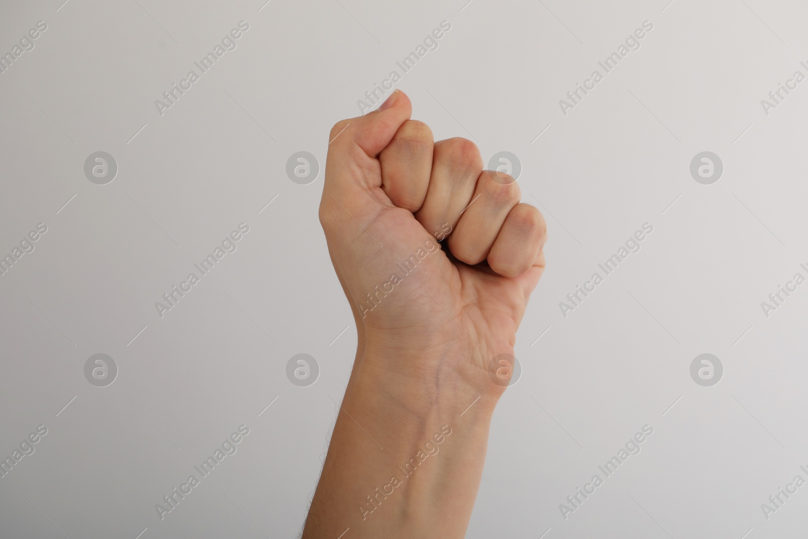 Photo of Woman with visible hand veins on light grey background, closeup