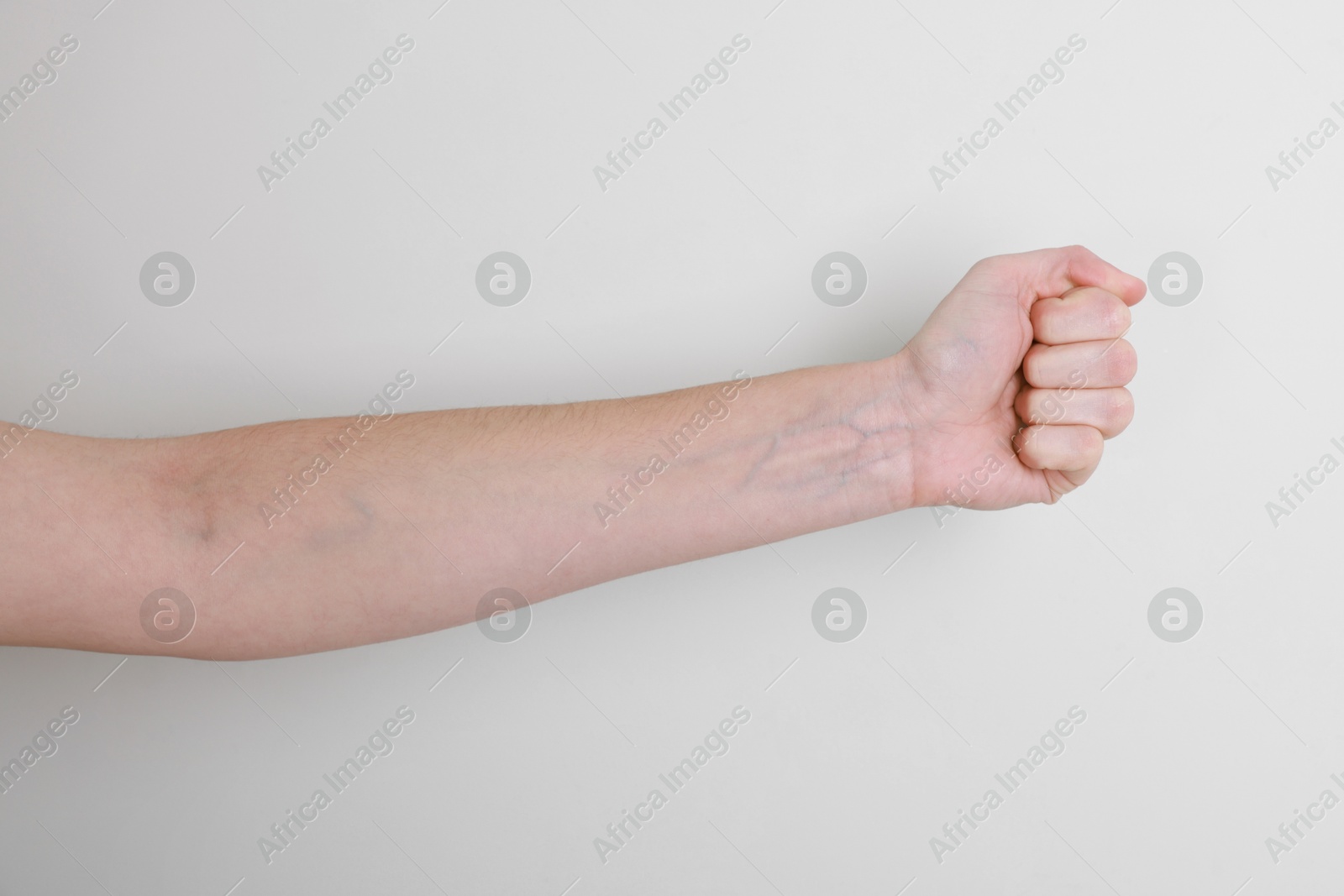 Photo of Woman with visible hand veins on white background, closeup