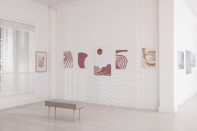 Photo of Interior of modern art gallery with beautiful paintings