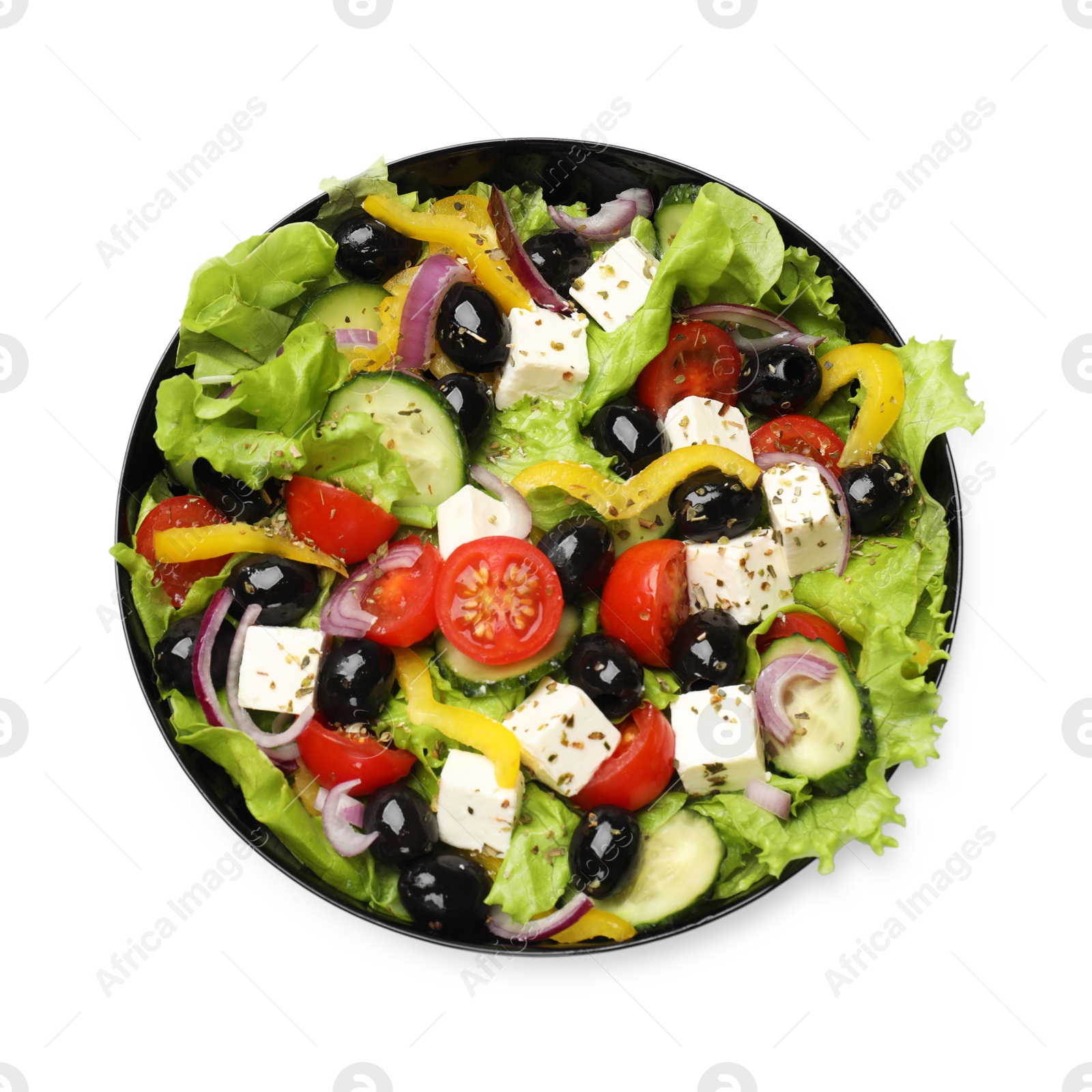 Photo of Delicious fresh Greek salad isolated on white, top view