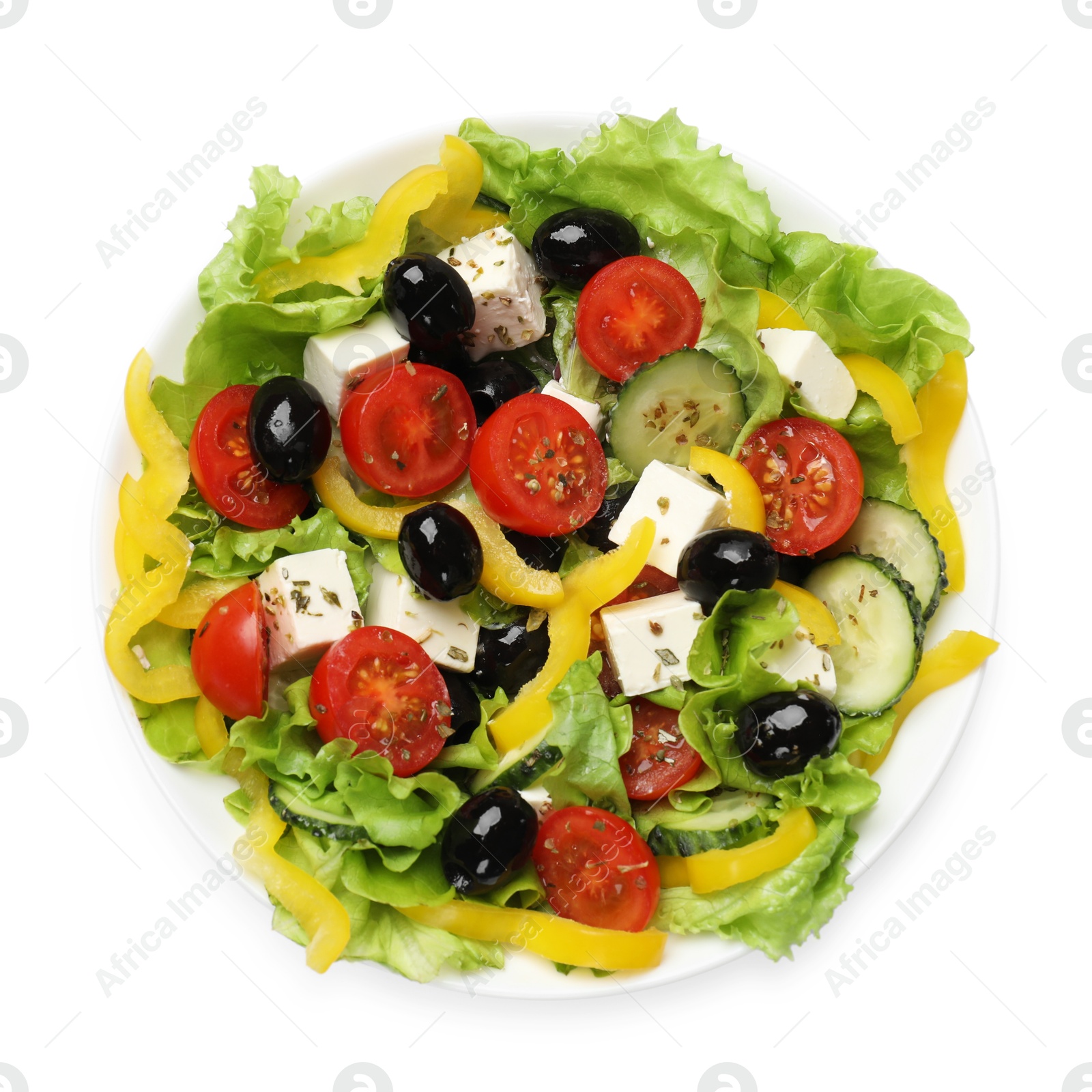 Photo of Delicious fresh Greek salad isolated on white, top view