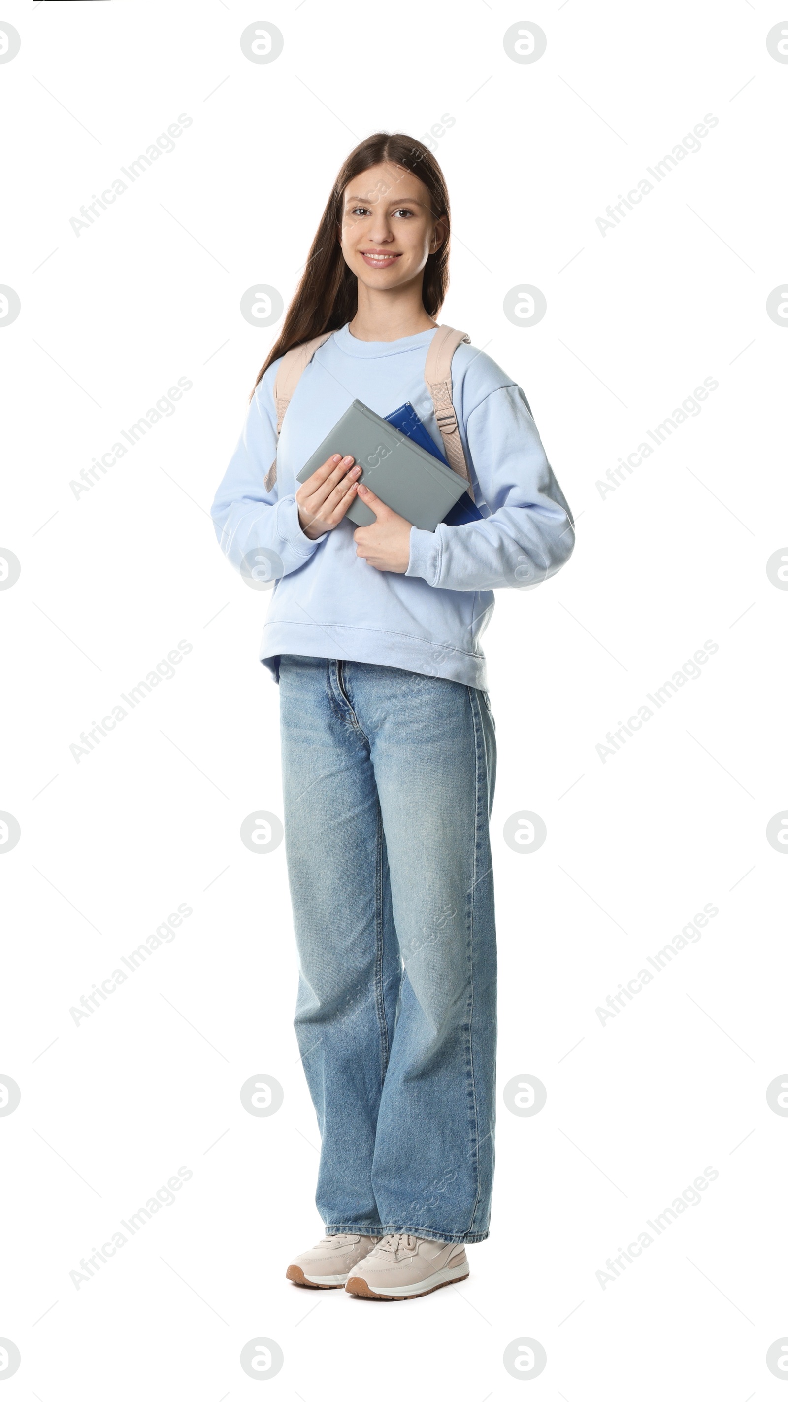 Photo of Smiling teenage girl with books on white background