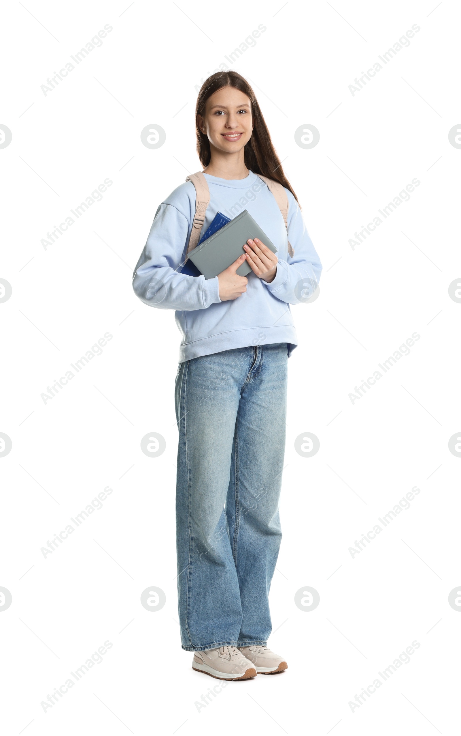 Photo of Smiling teenage girl with books on white background