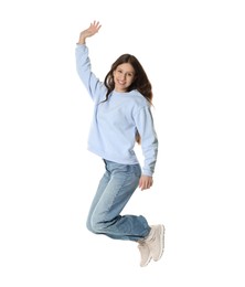 Photo of Smiling teenage girl jumping on white background