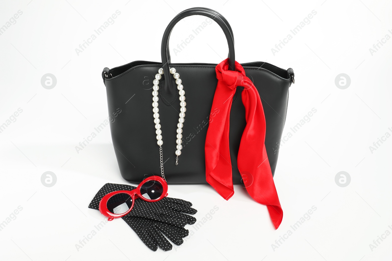 Photo of Stylish bag and other accessories on white background