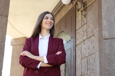 Photo of Portrait of young woman wearing stylish suit outdoors. Space for text