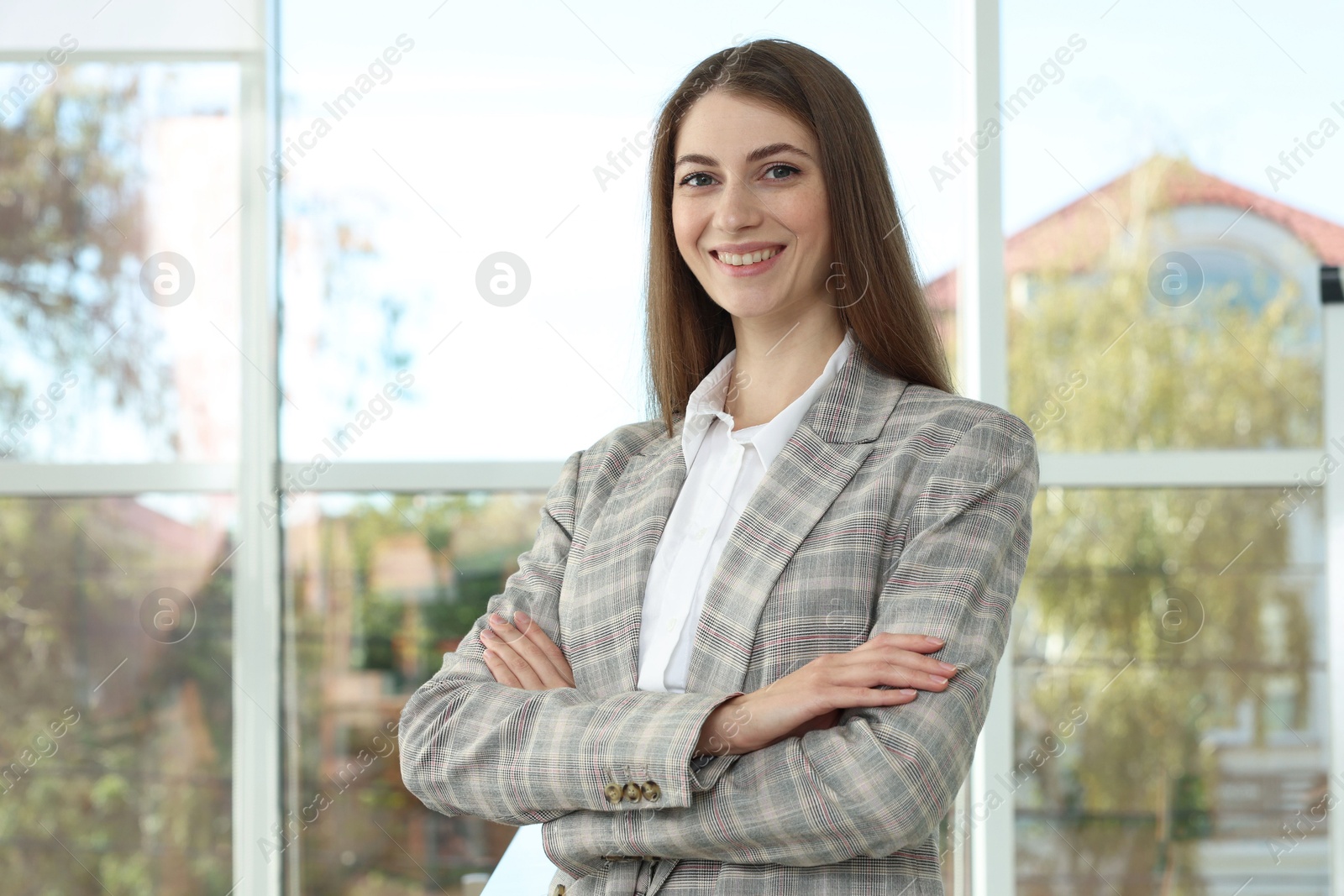 Photo of Portrait of young woman wearing stylish suit indoors