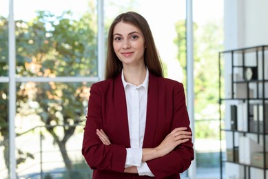 Photo of Portrait of young woman wearing stylish suit indoors