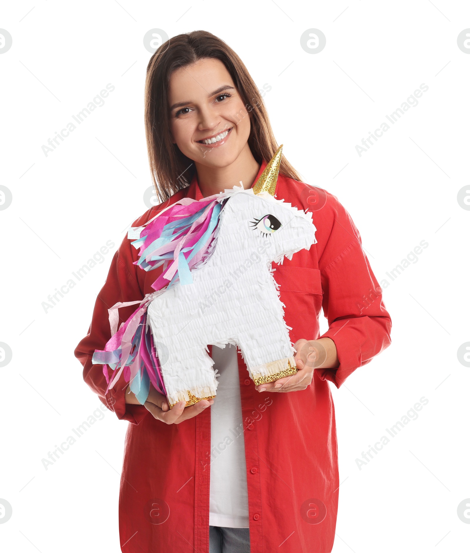 Photo of Happy woman with unicorn shaped pinata on white background