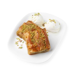 Photo of Delicious baklava with crushed nuts and ice cream isolated on white