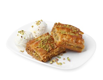 Photo of Delicious baklava with crushed nuts and ice cream isolated on white