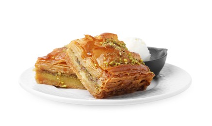 Photo of Delicious baklava with crushed nuts and ice cream isolated on white