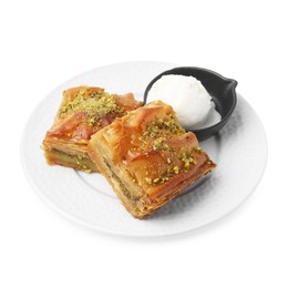 Photo of Delicious baklava with crushed nuts and ice cream isolated on white