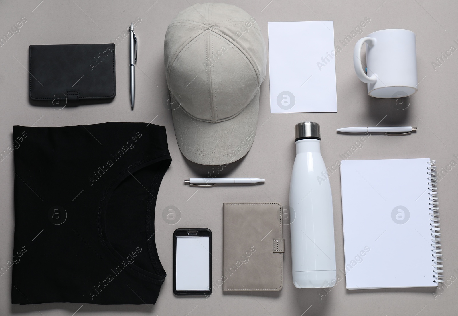 Photo of Different blank items for branding on grey background, flat lay. Mockup for design