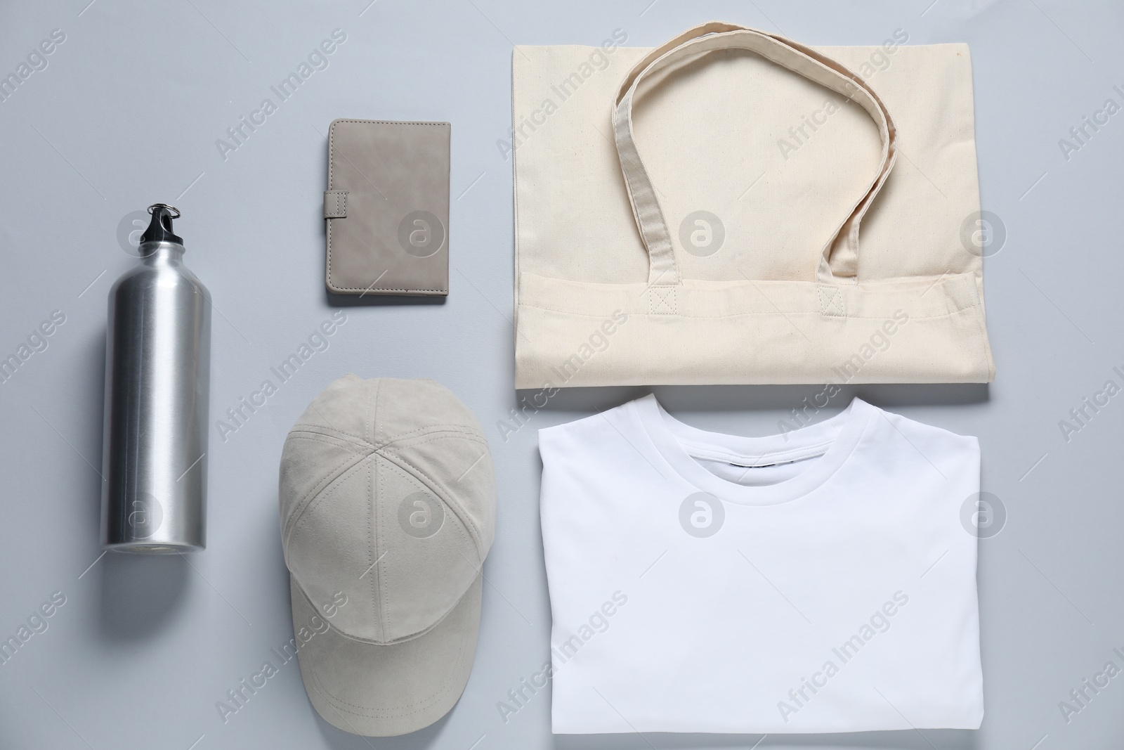 Photo of Different blank items for branding on grey background, flat lay. Mockup for design