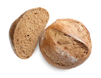 Photo of Whole and half of freshly baked bread isolated on white, top view