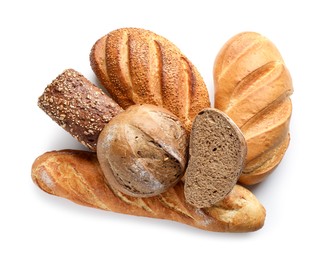 Photo of Whole and cut loafs of bread isolated on white, top view