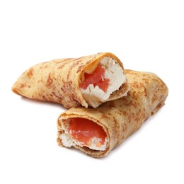 Photo of Delicious crepes with salmon and cream cheese isolated on white