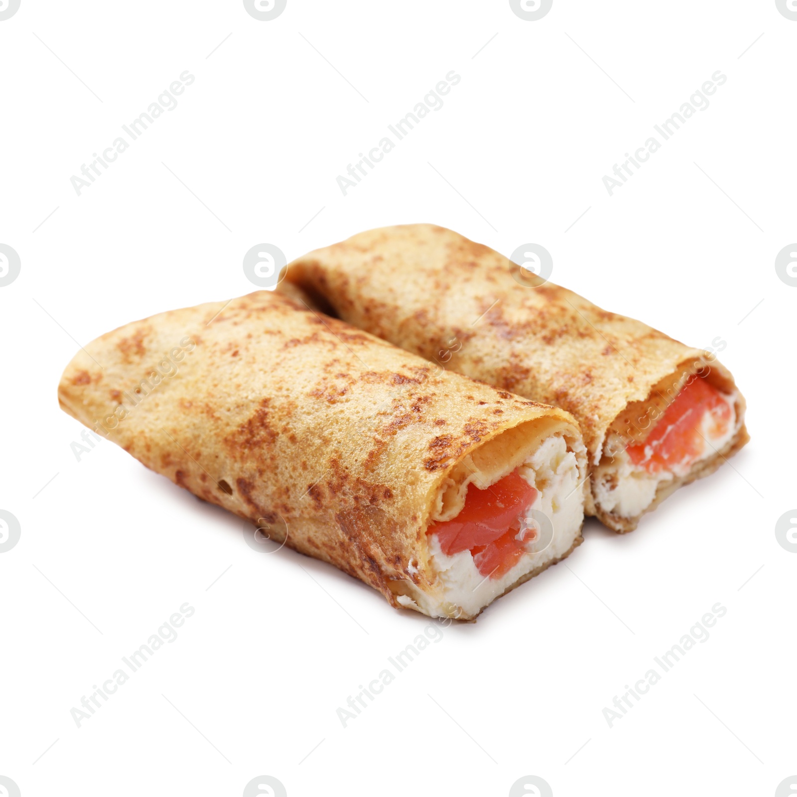 Photo of Delicious crepes with salmon and cream cheese isolated on white