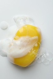 Photo of Soap bar with foam on white background, top view