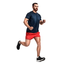 Handsome young man running on white background