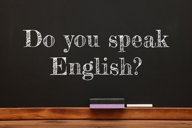 Image of Do You Speak English? text on black chalkboard. Language course