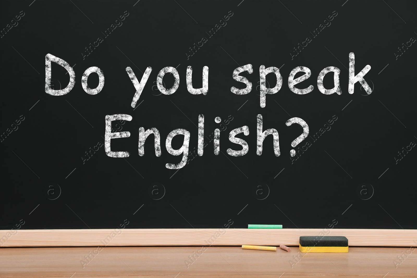 Image of Do You Speak English? text on black chalkboard. Language course