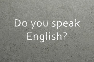 Image of Do You Speak English? text on grey textured background. Language course