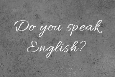 Image of Do You Speak English? text on grey textured background. Language course