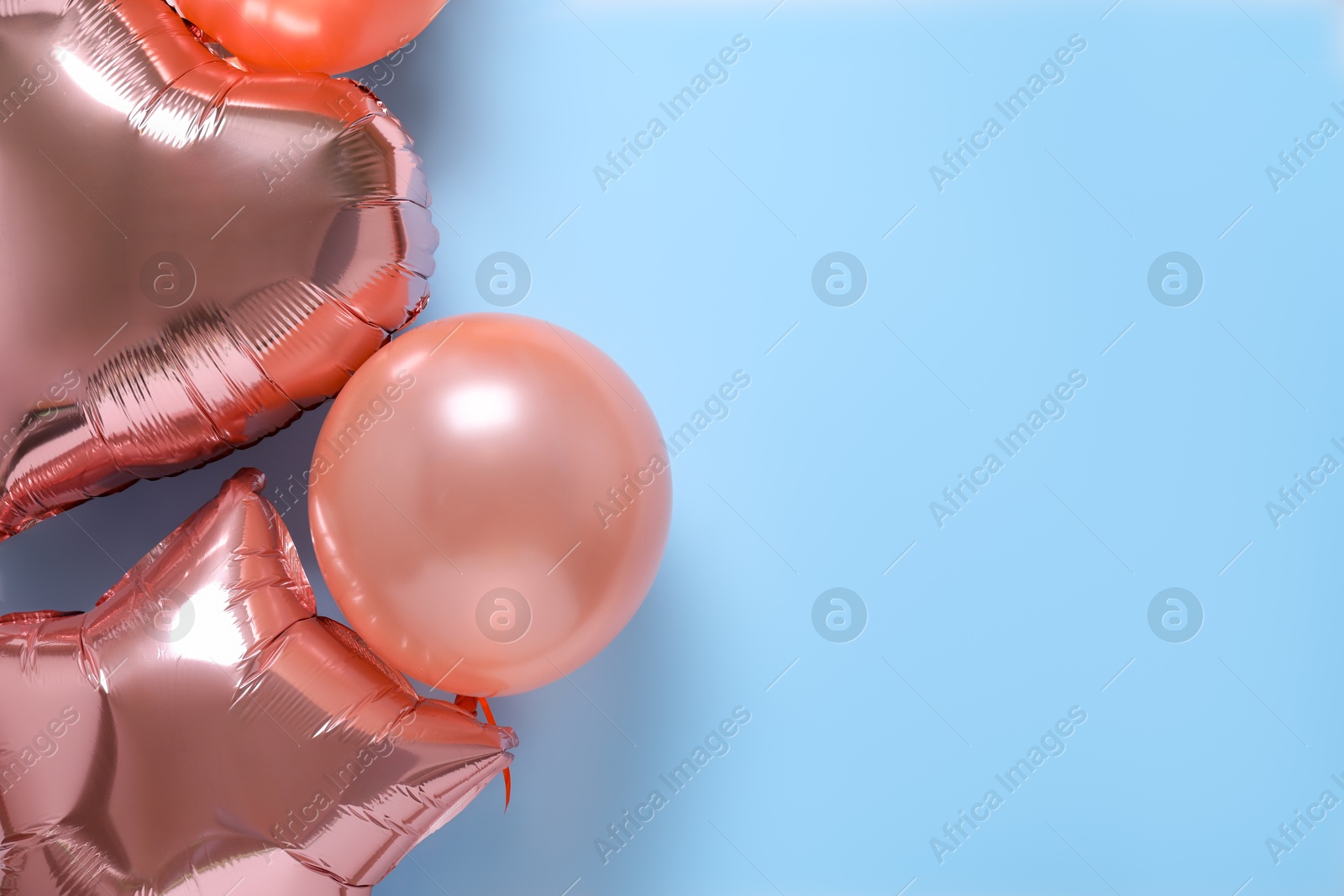 Photo of Festive balloons on color background, flat lay. Space for text