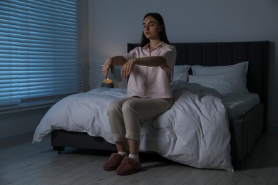 Photo of Young woman suffering from sleepwalking at home