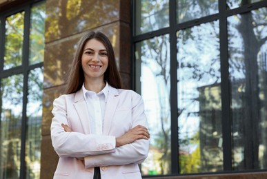 Photo of Portrait of young woman wearing stylish suit outdoors. Space for text