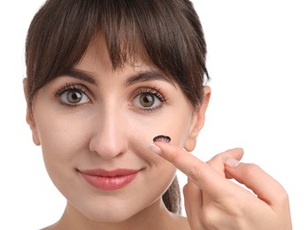 Young woman with color contact lens on white background, closeup