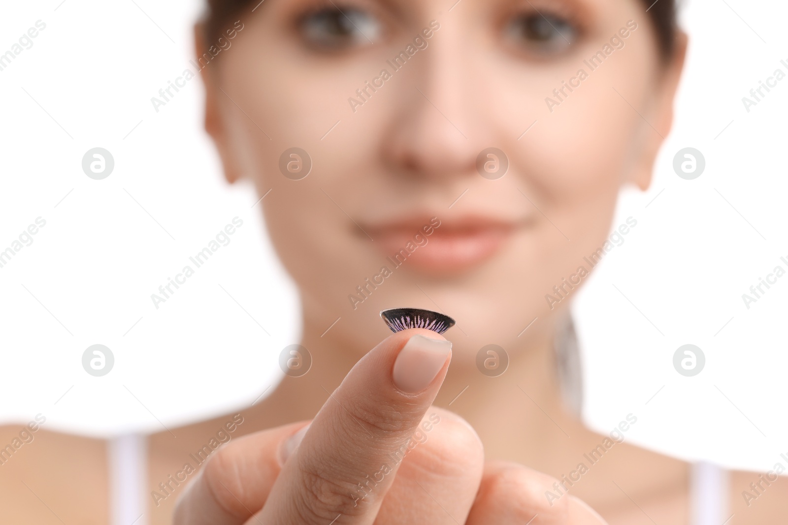 Photo of Young woman with color contact lens on white background, closeup. Selective focus