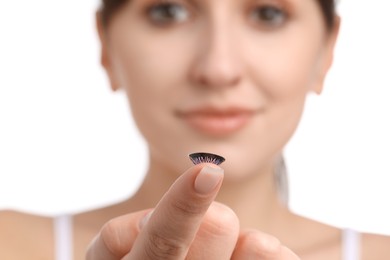 Photo of Young woman with color contact lens on white background, closeup. Selective focus