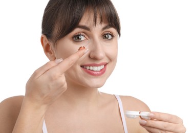 Photo of Young woman with red color contact lens and case on white background